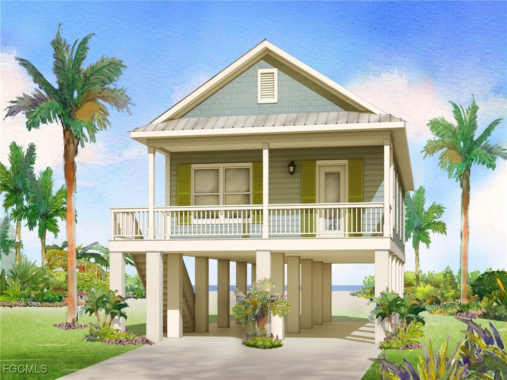 112 Blackbeard Way Fort Myers Beach, FL 33931 - Photo 1 of 1 a front view of a house with garden