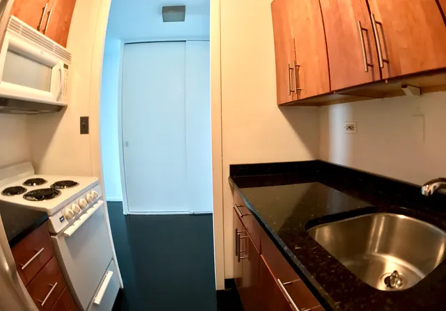 a view of hallway with hardwood floor