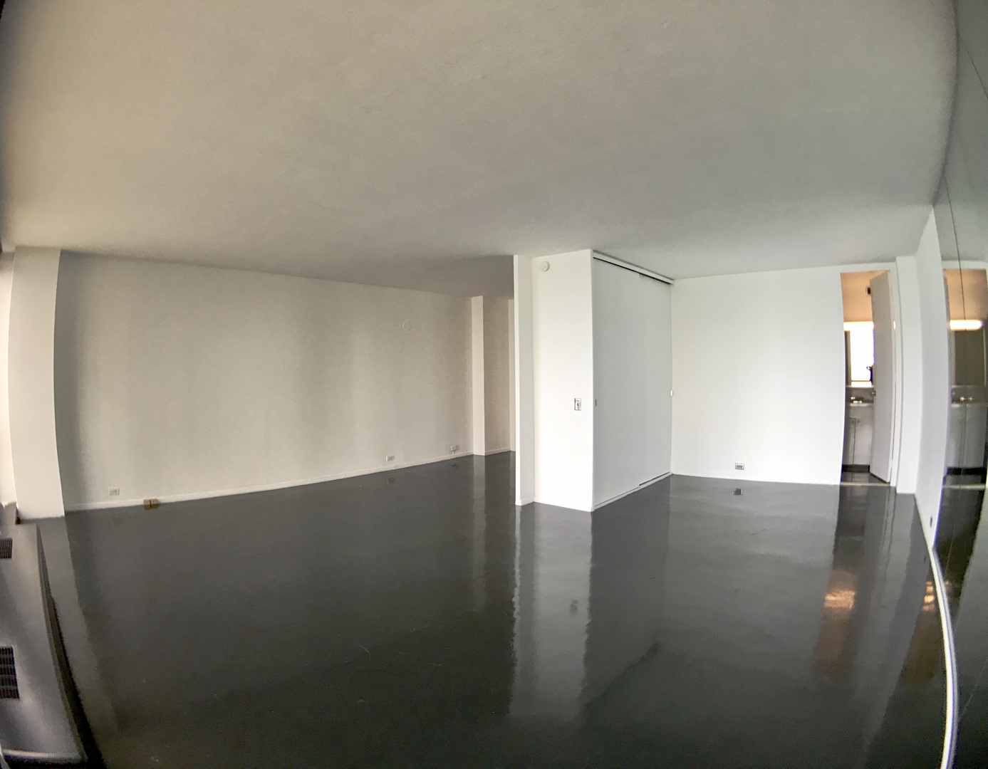 900 North Lake Shore Drive, Unit 1211 Chicago, IL 60611 - Photo 4 of 37 a view of an empty room with wooden floor and a window