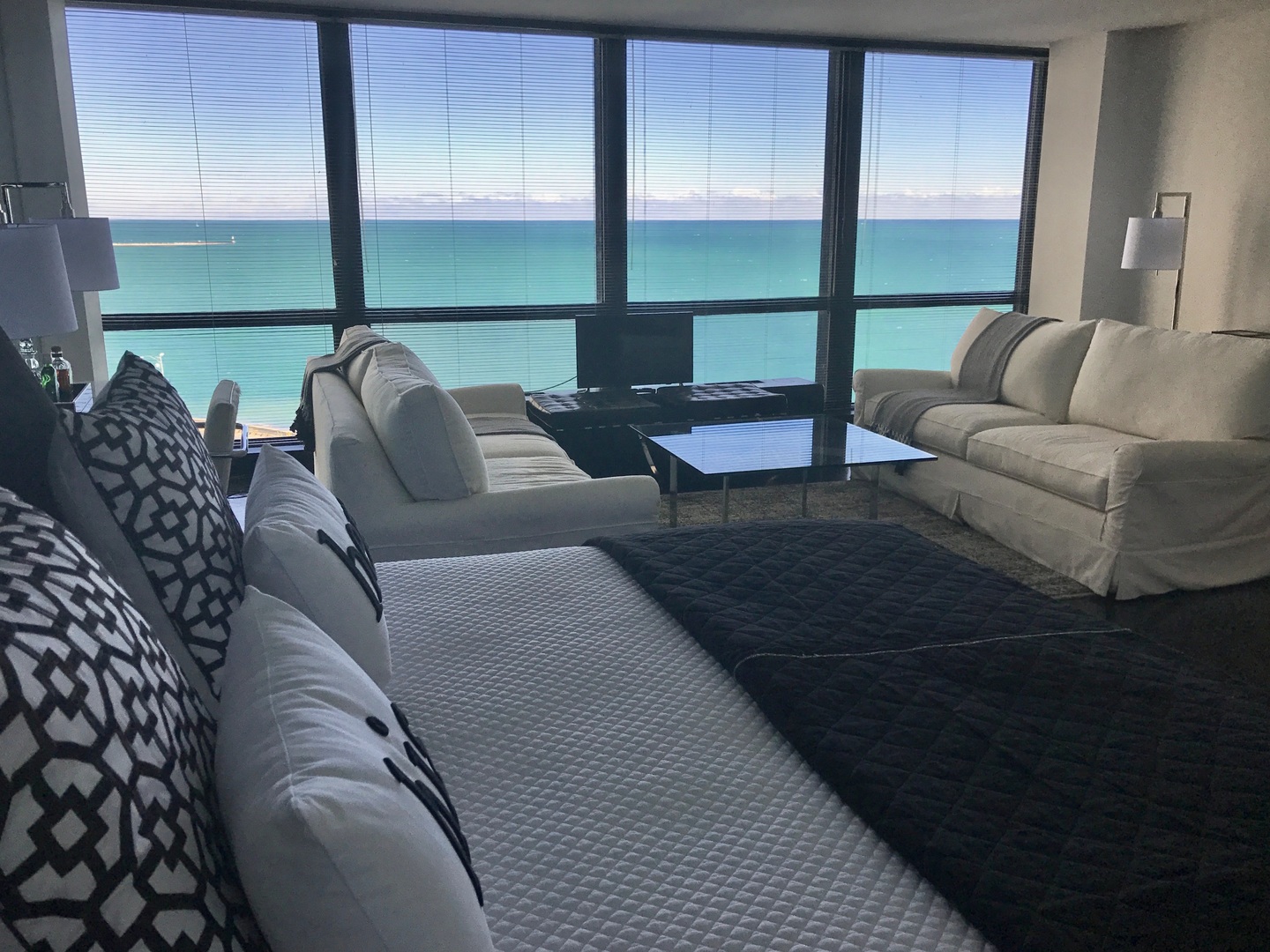 900 North Lake Shore Drive, Unit 1211 Chicago, IL 60611 - Photo 6 of 37 a living room with furniture and floor to ceiling window