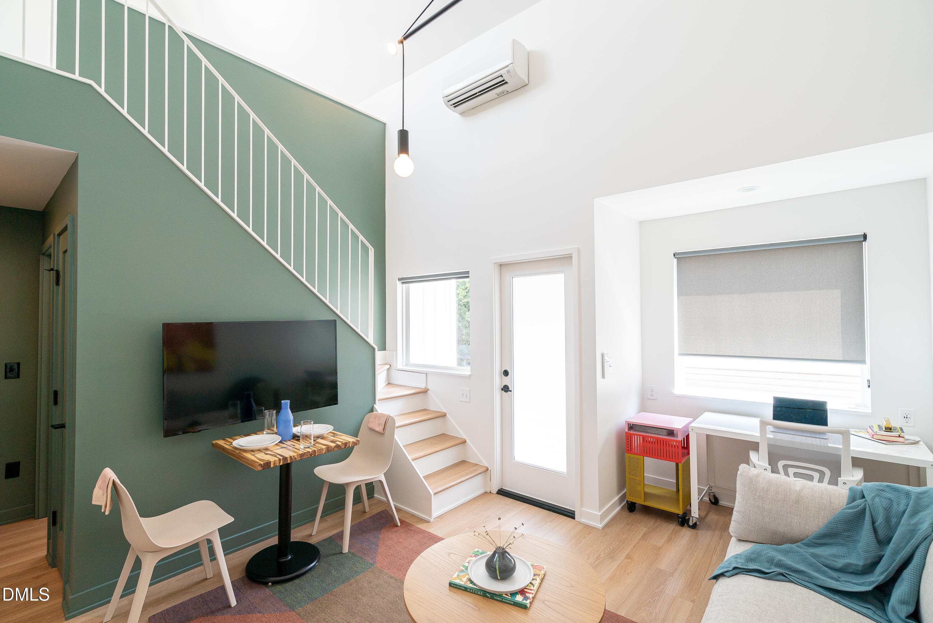 901 East Edenton Street, Unit 7 Raleigh, NC 27601 - Photo 1 of 25 a living room with furniture and a flat screen tv