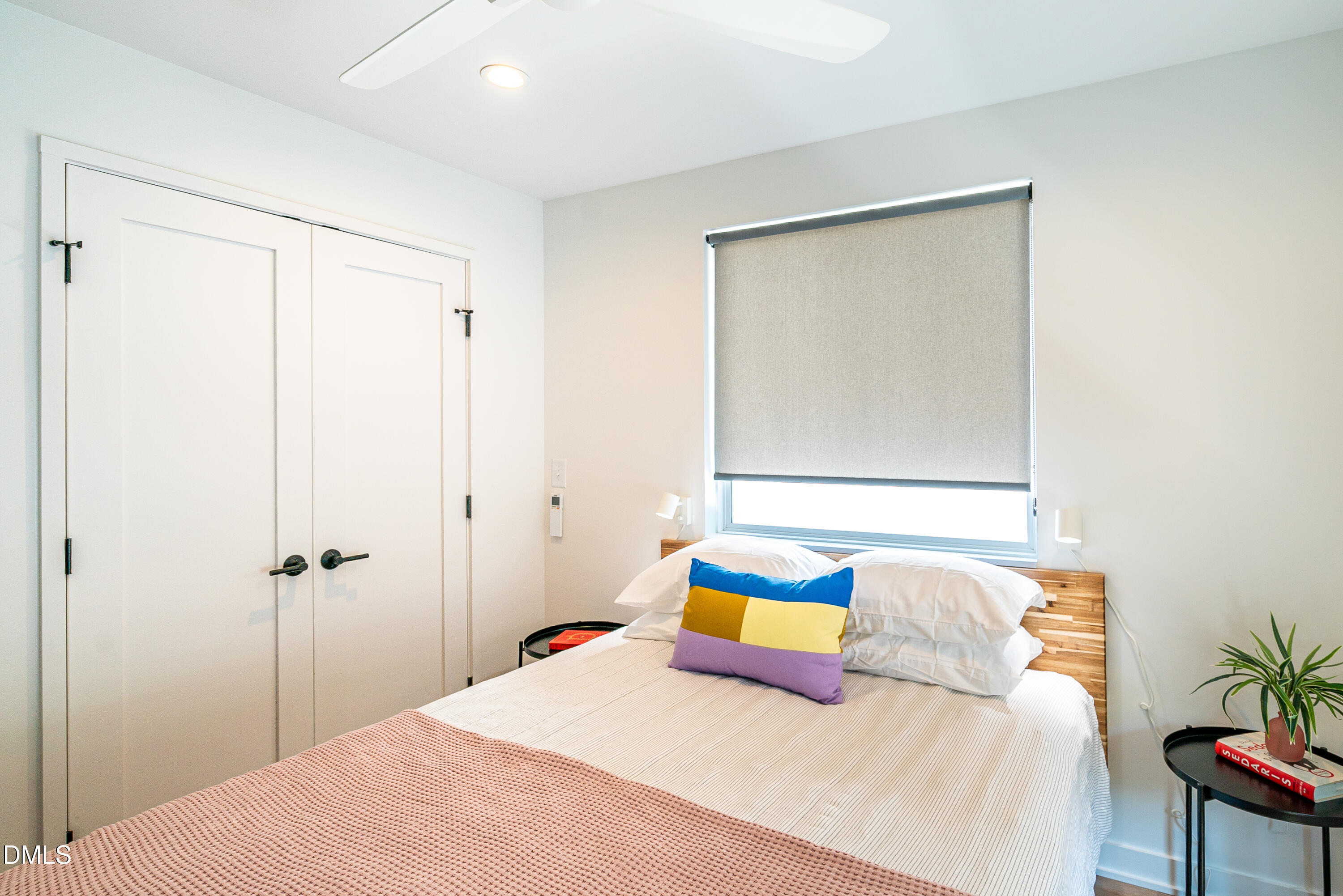 901 East Edenton Street, Unit 7 Raleigh, NC 27601 - Photo 11 of 25 a bedroom with a bed and a table