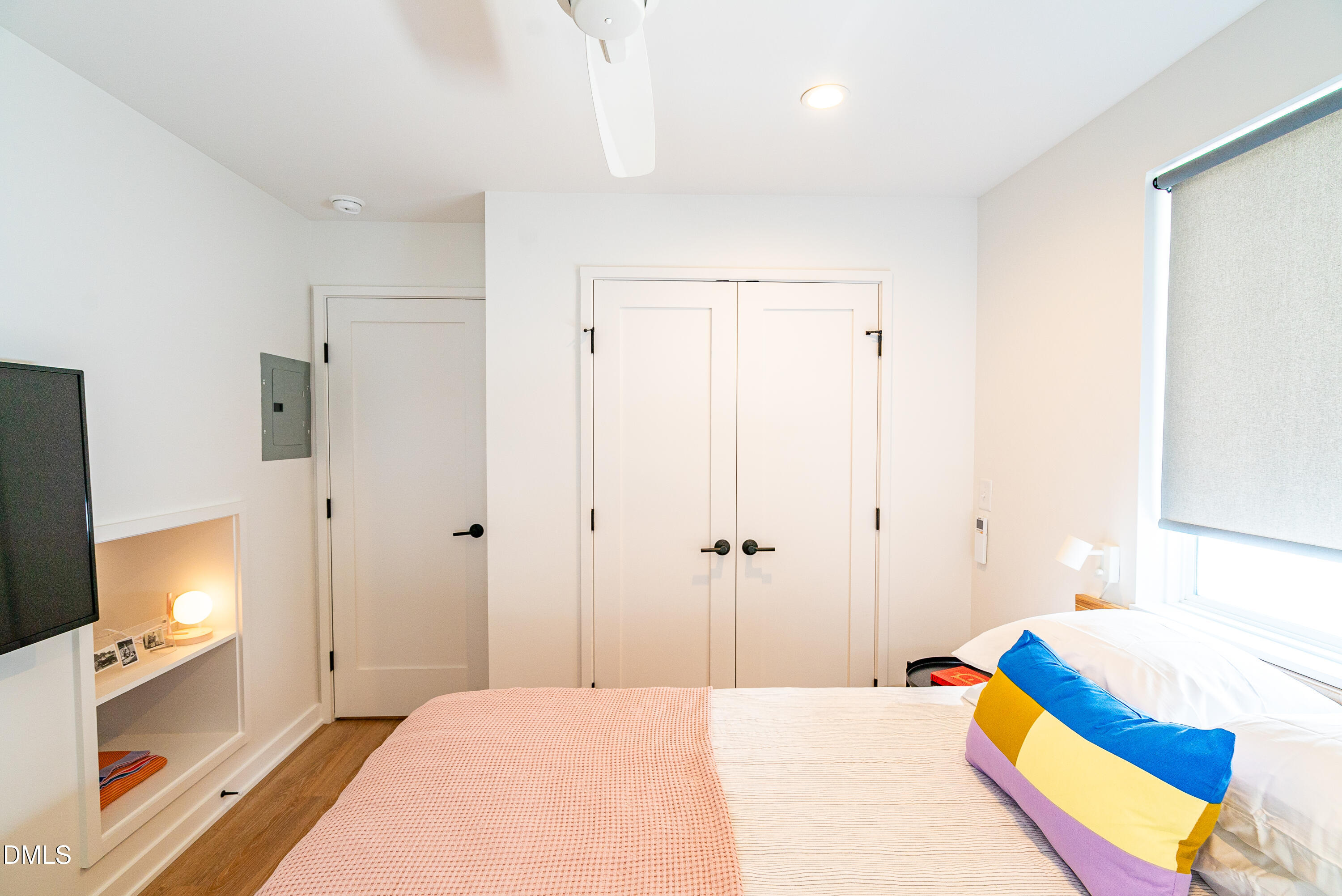 901 East Edenton Street, Unit 7 Raleigh, NC 27601 - Photo 12 of 25 a bedroom with a bed and a small space