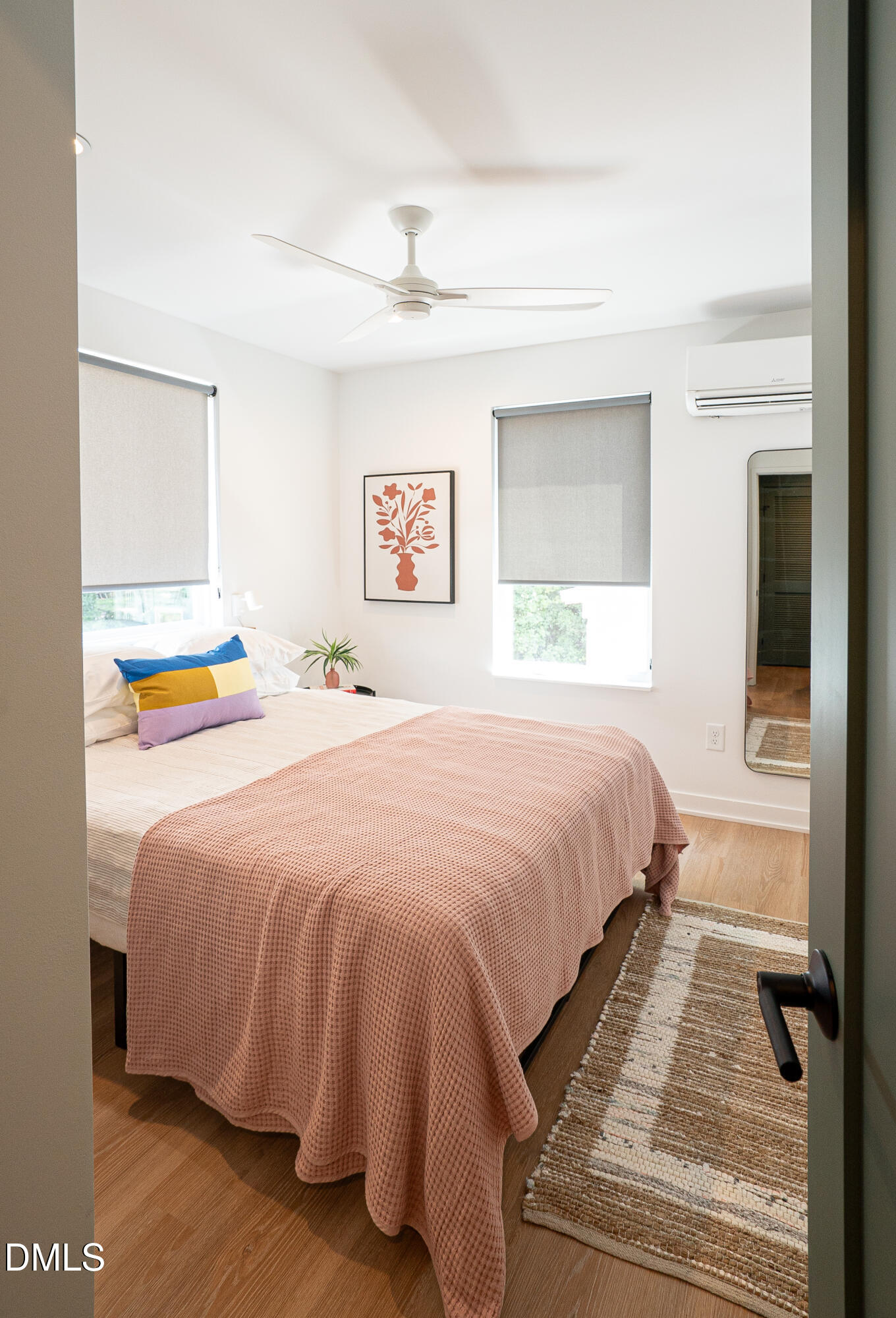 901 East Edenton Street, Unit 7 Raleigh, NC 27601 - Photo 13 of 25 a bedroom with a bed and a painting on the wall