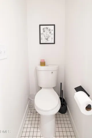 a white toilet sitting next to a white sink