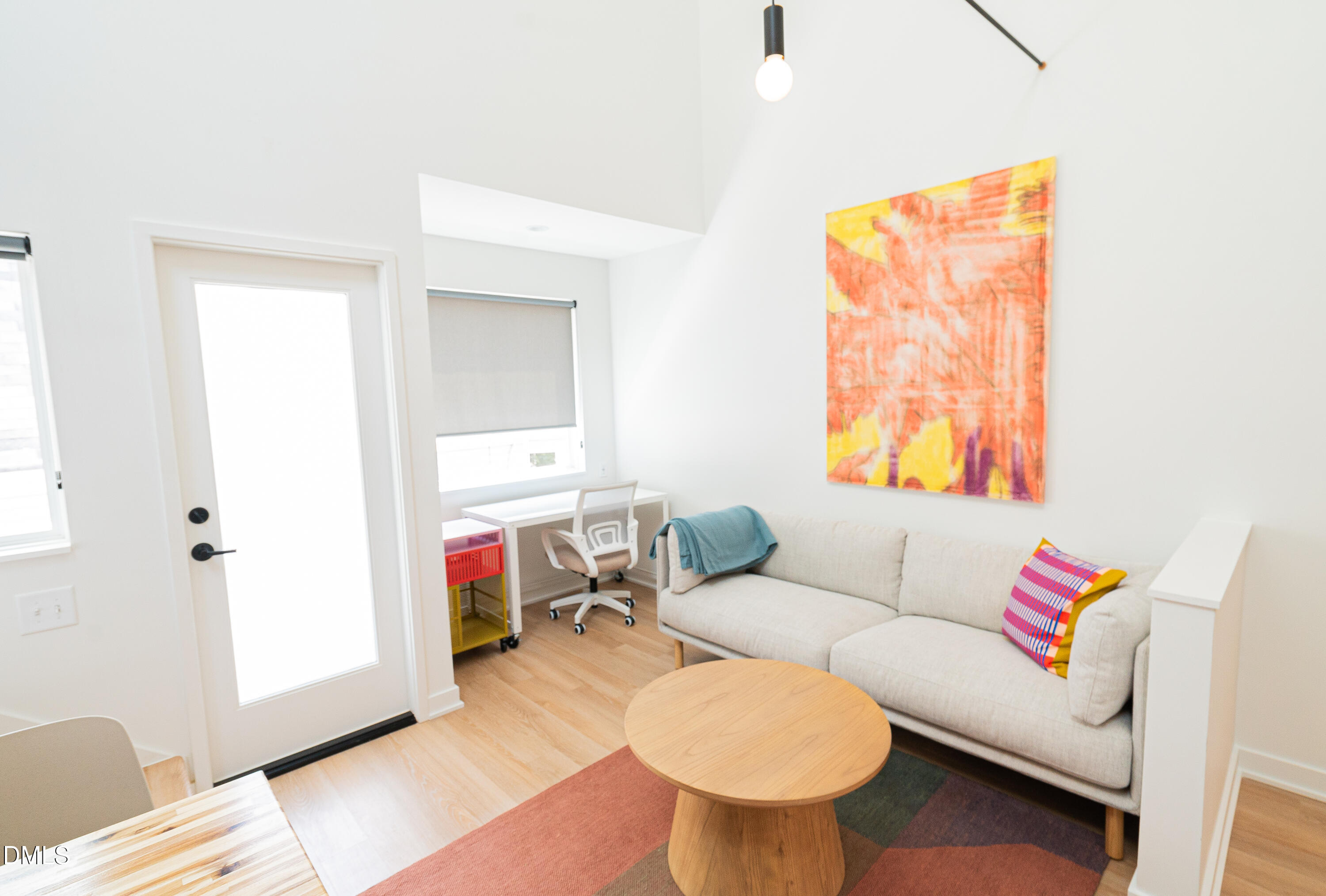 901 East Edenton Street, Unit 7 Raleigh, NC 27601 - Photo 18 of 25 a living room with furniture a flat screen tv and a window
