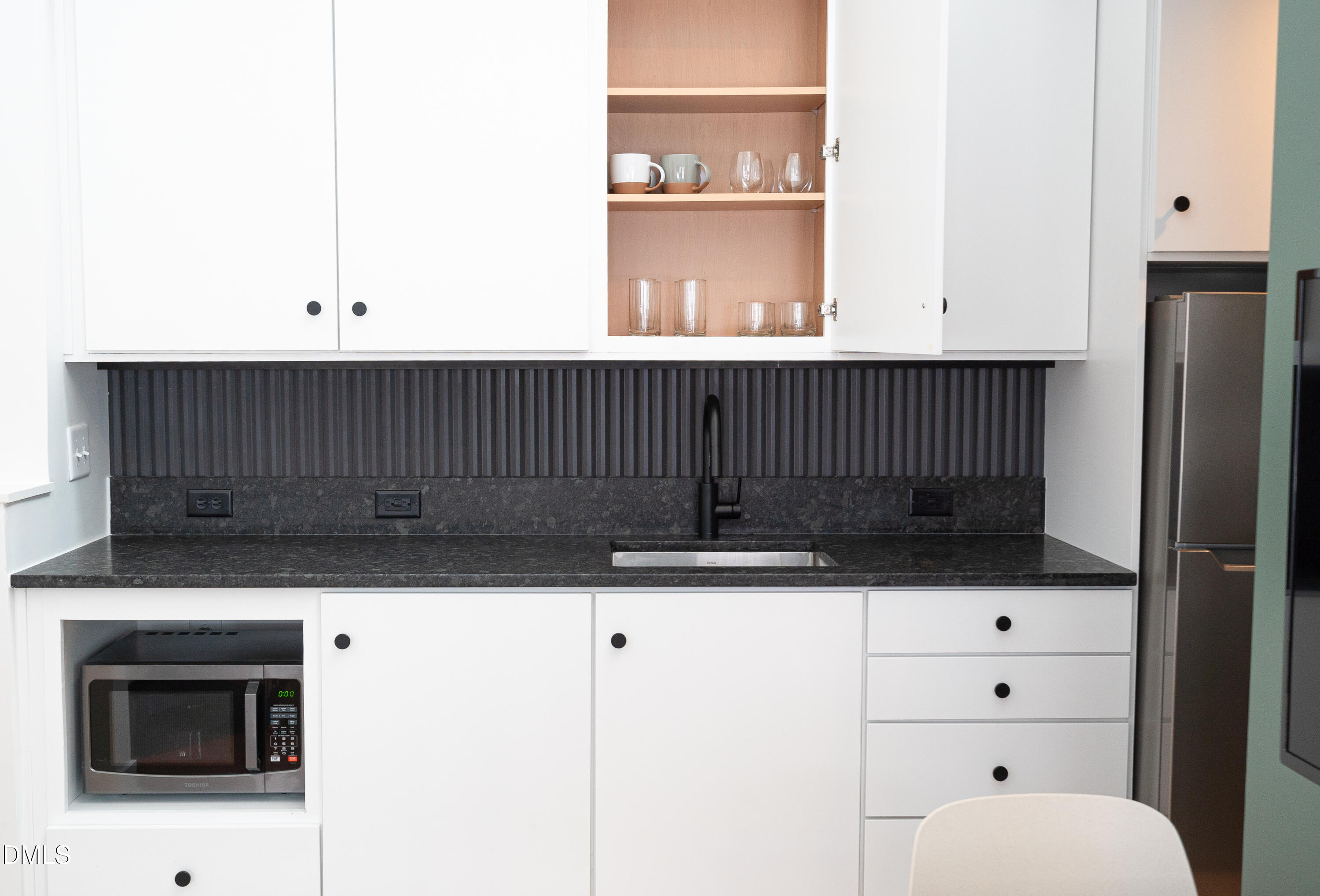 901 East Edenton Street, Unit 7 Raleigh, NC 27601 - Photo 23 of 25 a bathroom with a sink a toilet and a mirror