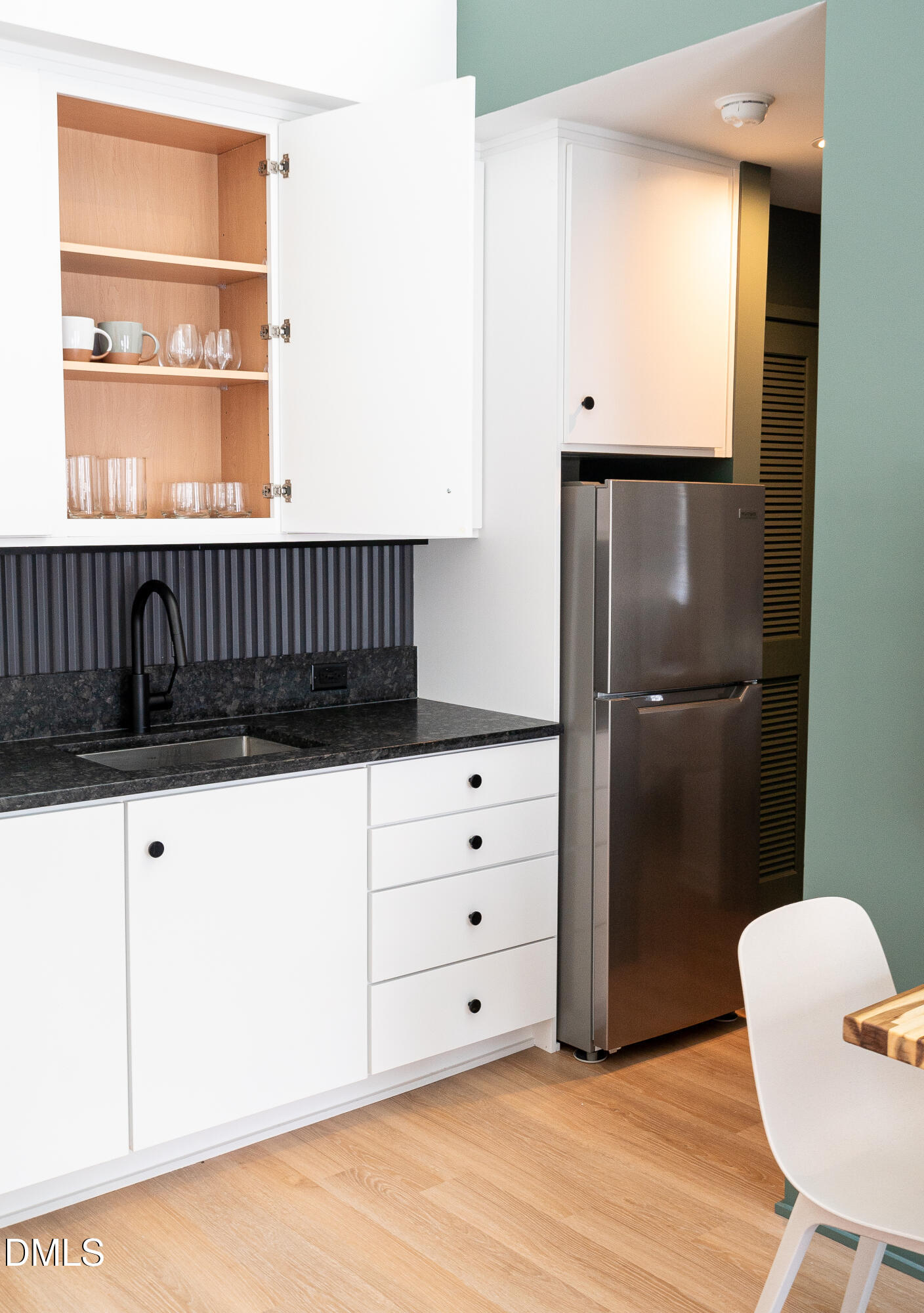 901 East Edenton Street, Unit 7 Raleigh, NC 27601 - Photo 24 of 25 a kitchen with a wooden floor