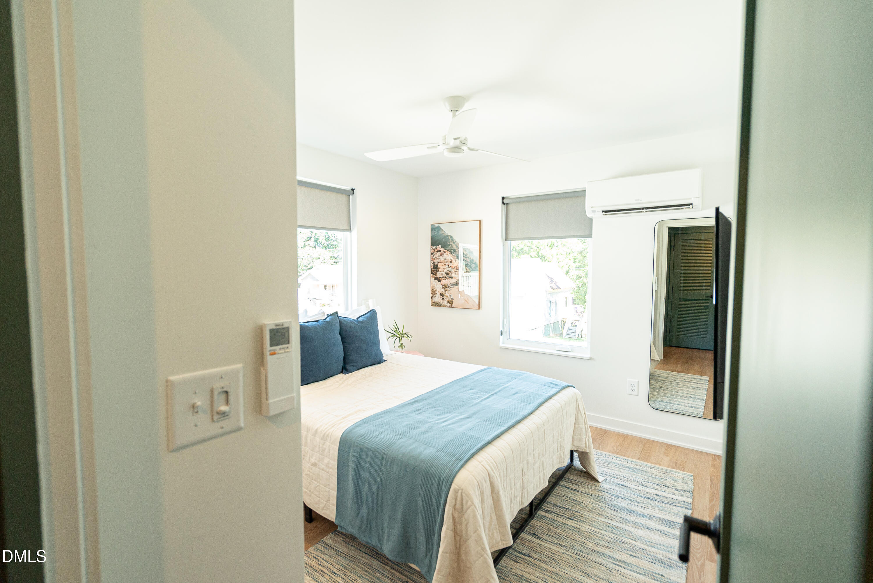 901 East Edenton Street, Unit 7 Raleigh, NC 27601 - Photo 4 of 25 a bedroom with a bed and a window