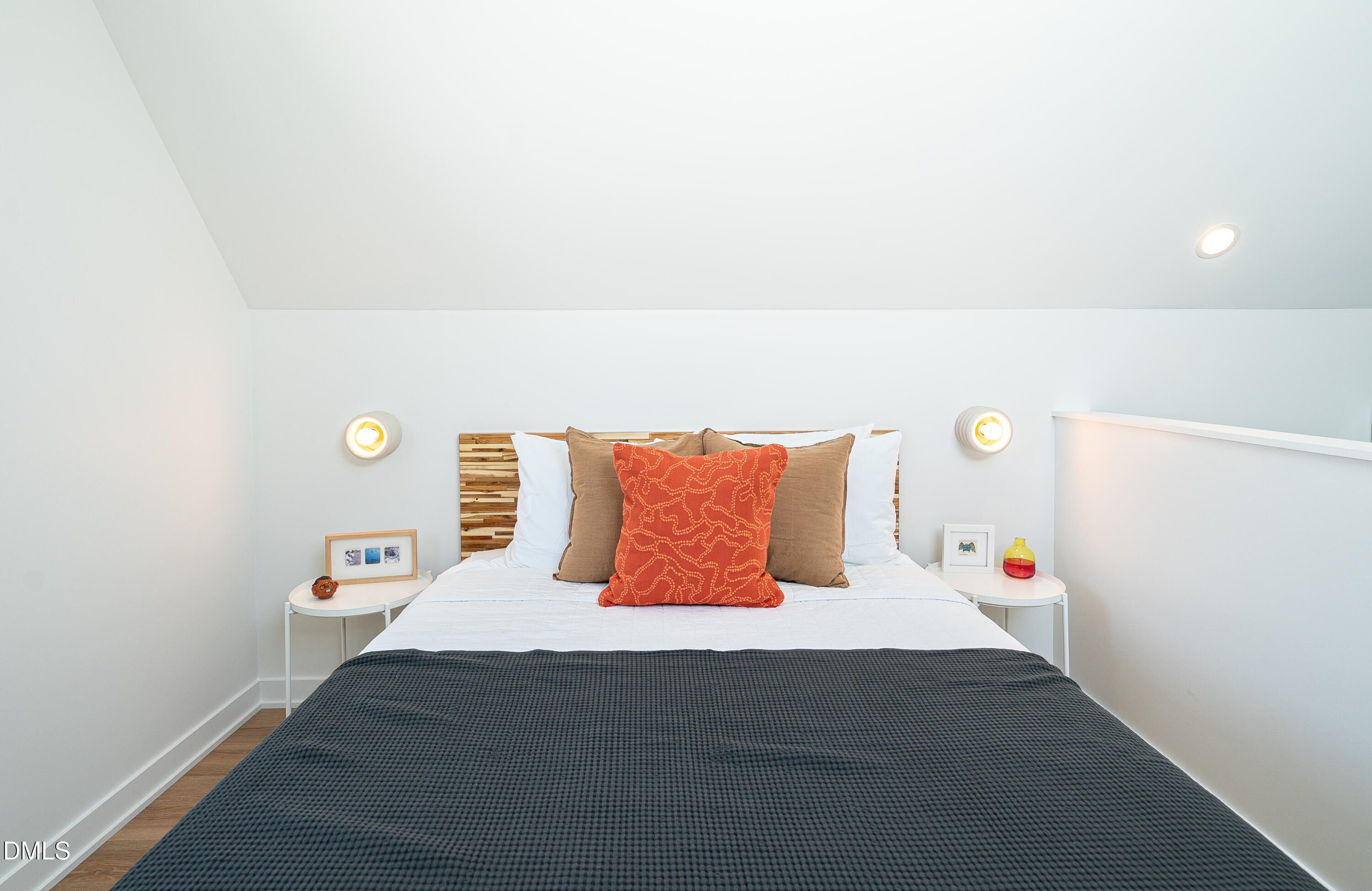 901 East Edenton Street, Unit 7 Raleigh, NC 27601 - Photo 5 of 25 a bedroom with a bed and a night stand