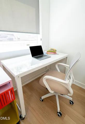 a room with a table and chairs