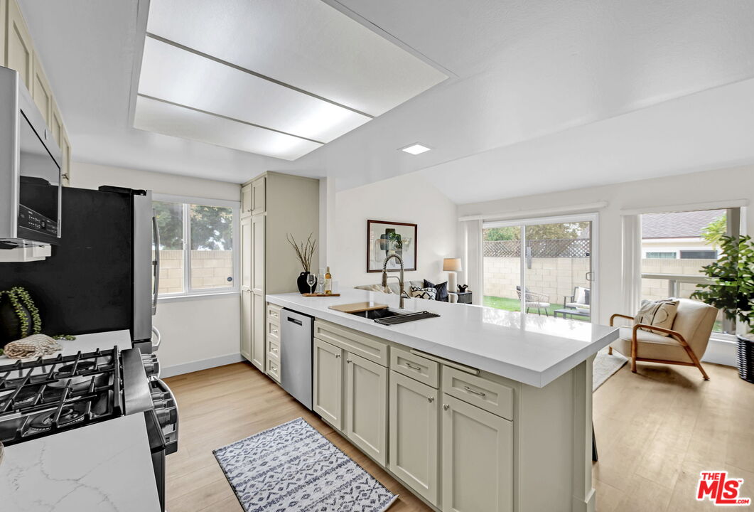 1701 Shaw Circle Placentia, CA 92870 - Photo 7 of 25 a kitchen with sink refrigerator and stove