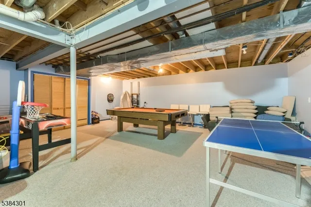 a view of a patio with a table and chairs next to a yard