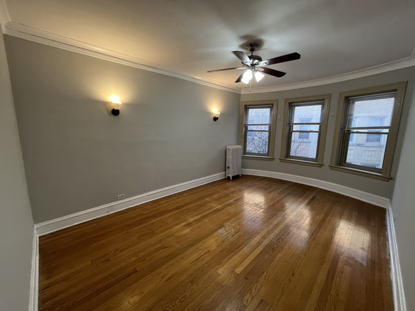 Undisclosed Address Chicago, IL 60625 - Photo 11 of 13 an empty room with wooden floor and windows
