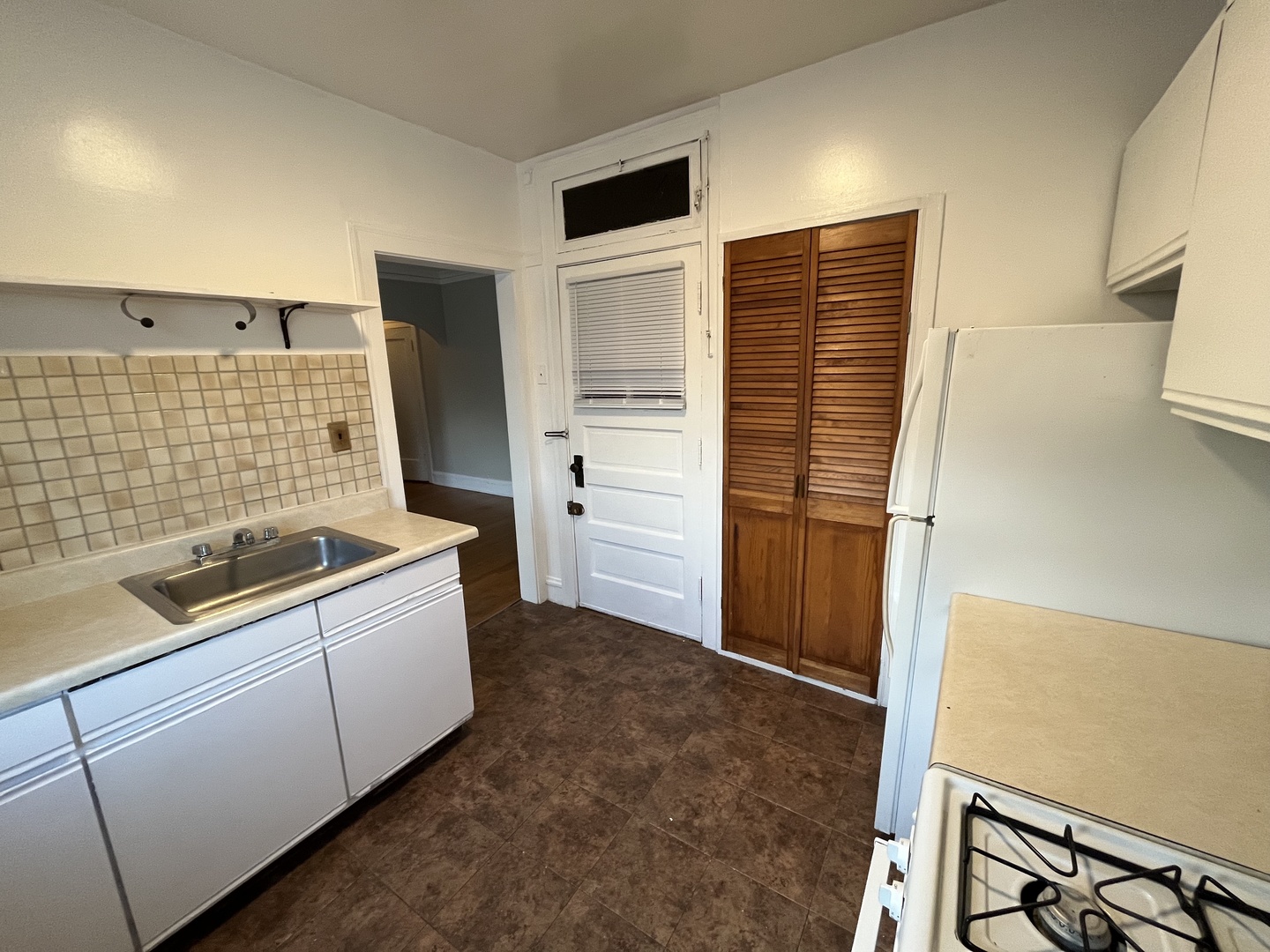 Undisclosed Address Chicago, IL 60625 - Photo 3 of 13 a bathroom with a sink and a shower