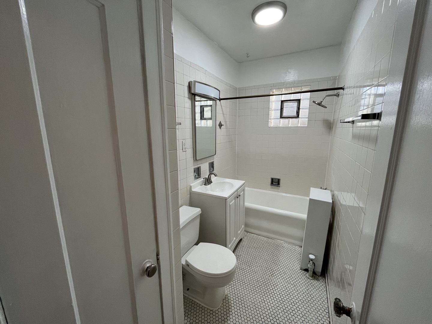 Undisclosed Address Chicago, IL 60625 - Photo 8 of 13 a bathroom with a toilet sink and shower