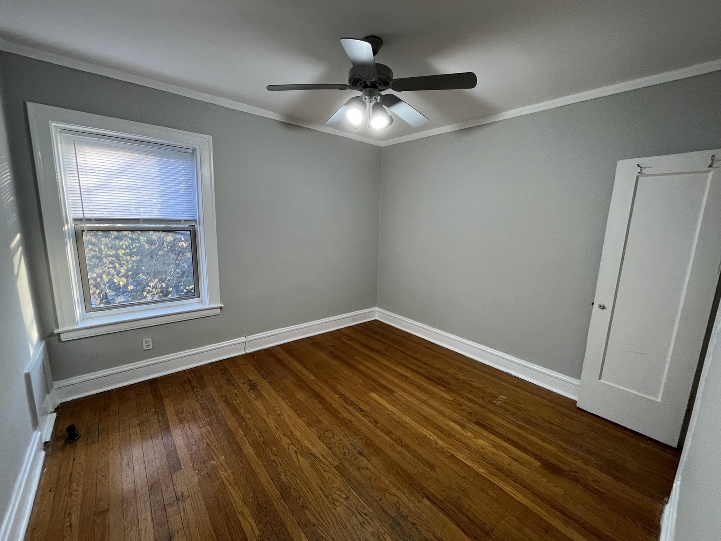 Undisclosed Address Chicago, IL 60625 - Photo 9 of 13 a view of an empty room with wooden floor and a window