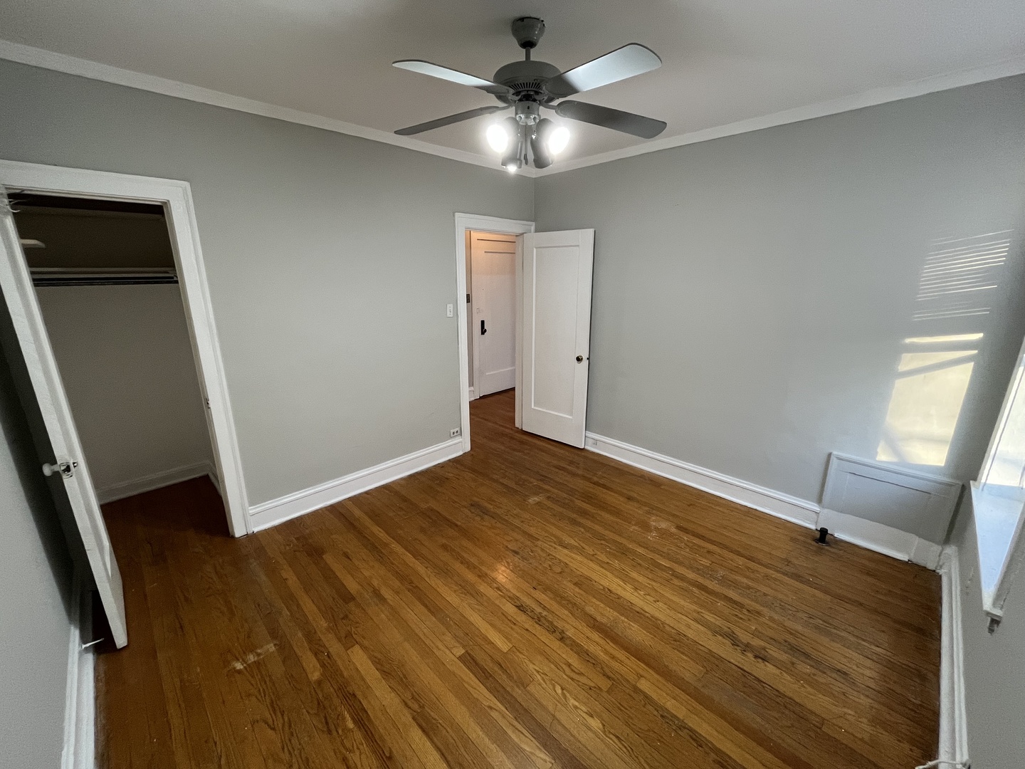 Undisclosed Address Chicago, IL 60625 - Photo 10 of 13 wooden floor in an empty room with a window