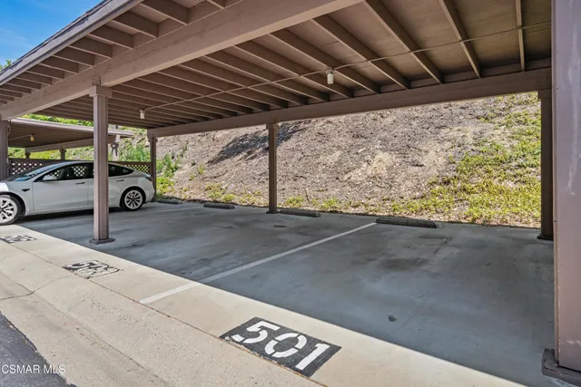a view of garden with a bench