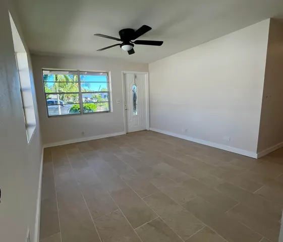 a view of an empty room with a window