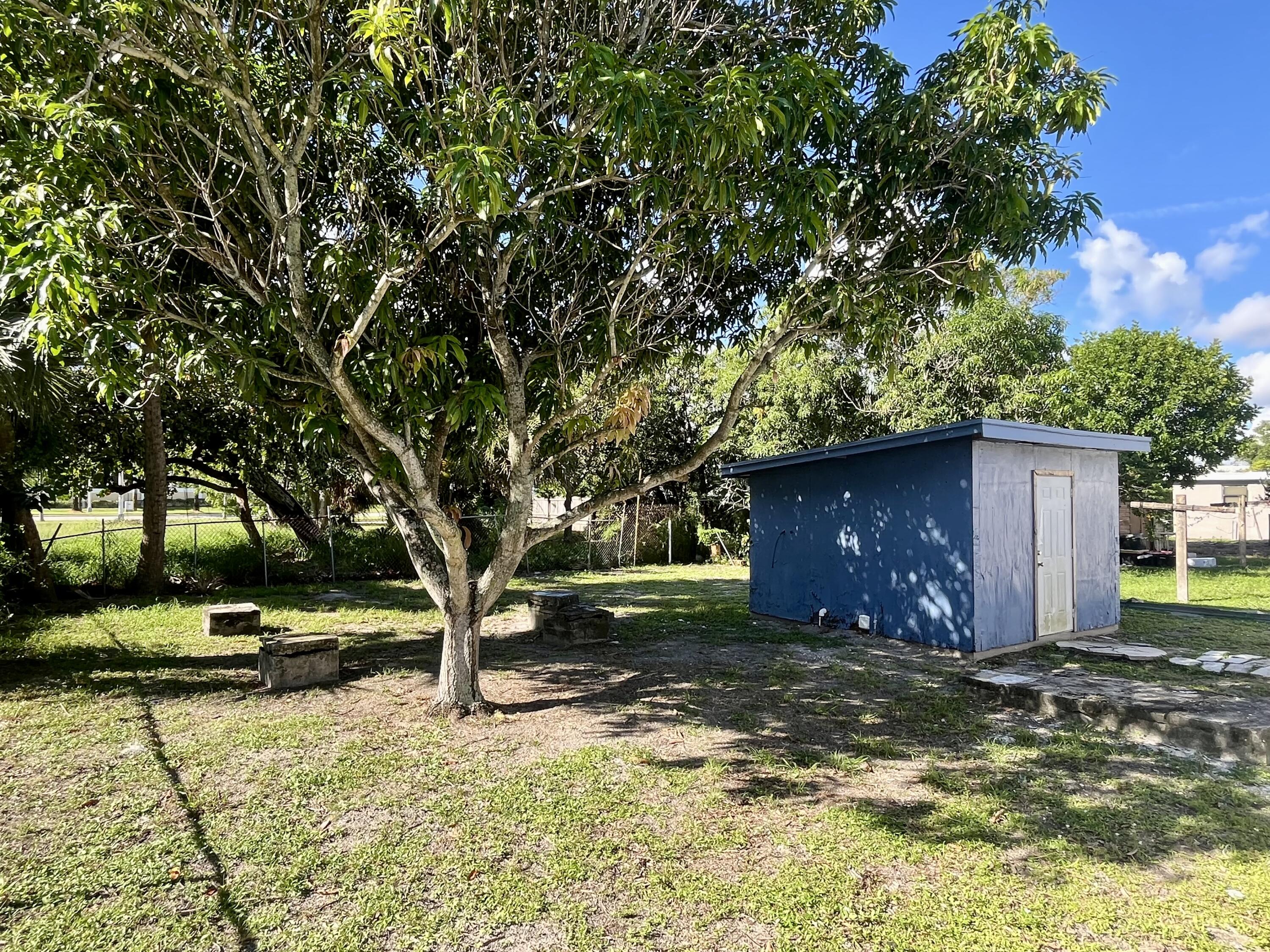 725 West 9th Street Riviera Beach, FL 33404 - Photo 3 of 6 a view of swimming pool with a yard