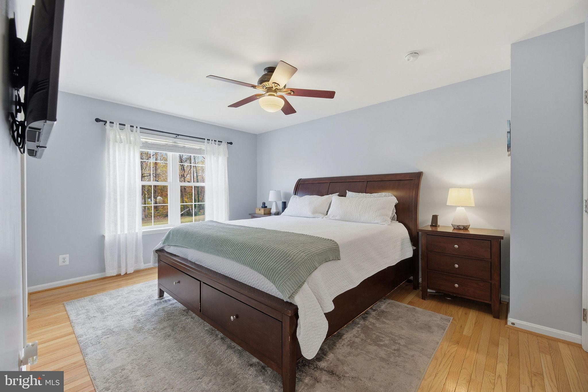 1719 Lottie Fowler Road Prince Frederick, MD 20678 - Photo 16 of 62 a spacious bedroom with a bed and a window