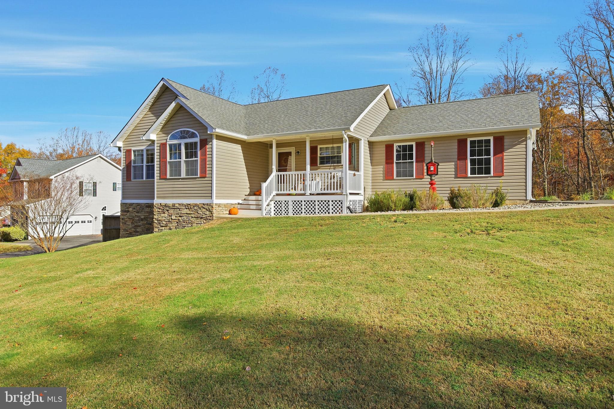 1719 Lottie Fowler Road Prince Frederick, MD 20678 - Photo 2 of 62 a front view of a house with a yard