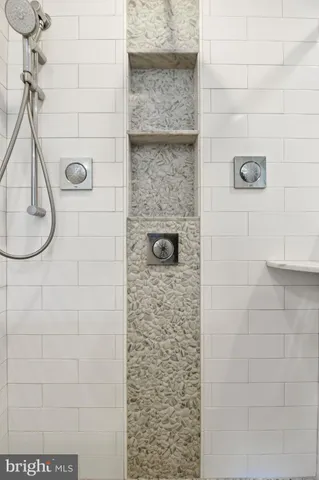 a close view of a sink in a white cabinet