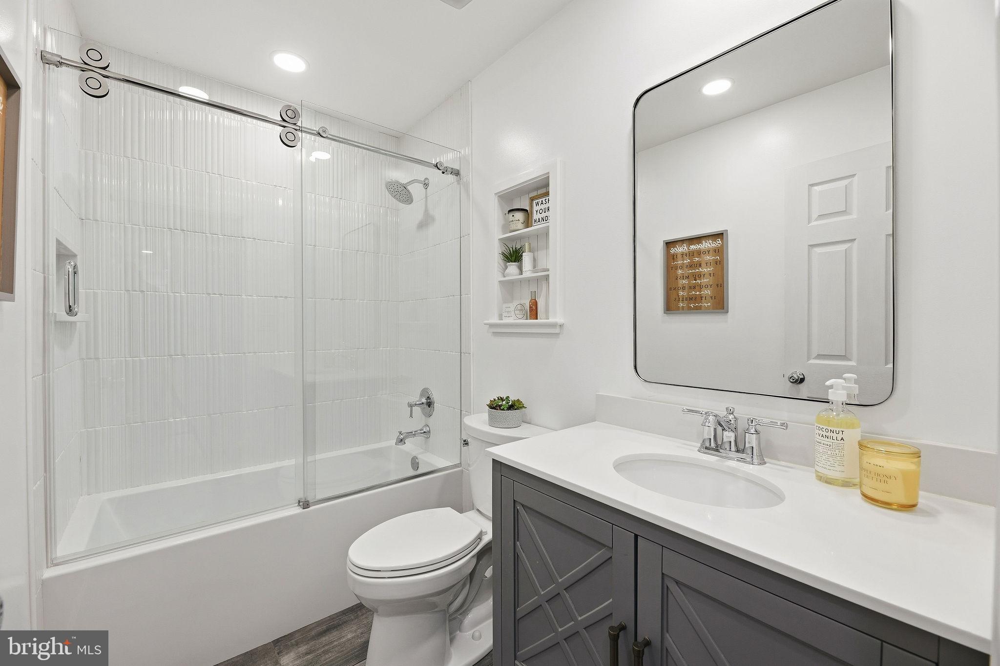 1719 Lottie Fowler Road Prince Frederick, MD 20678 - Photo 25 of 62 a bathroom with a sink a toilet and shower