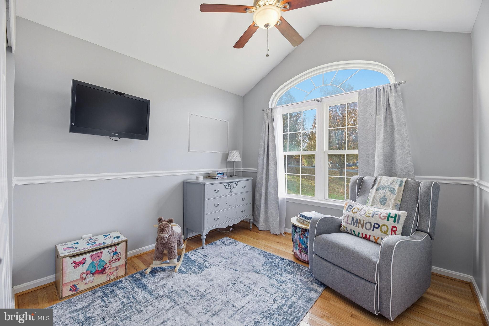 1719 Lottie Fowler Road Prince Frederick, MD 20678 - Photo 28 of 62 a living room with furniture and a flat screen tv