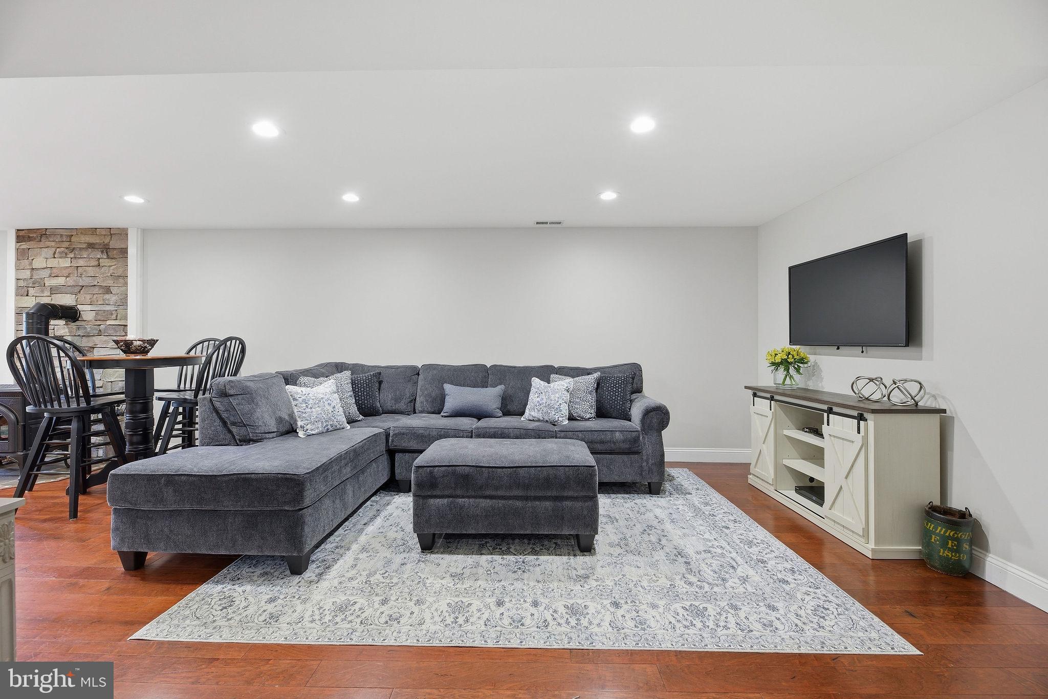 1719 Lottie Fowler Road Prince Frederick, MD 20678 - Photo 30 of 62 a living room with furniture and a flat screen tv