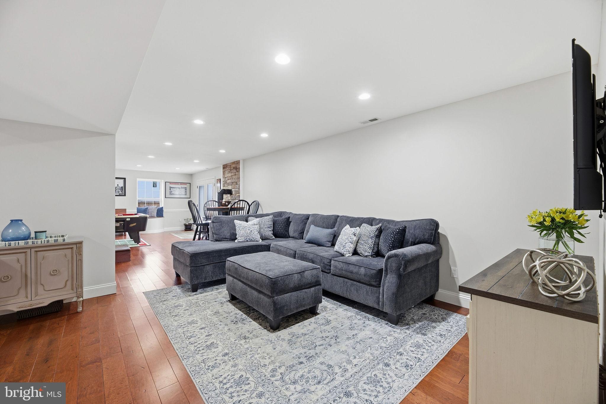 1719 Lottie Fowler Road Prince Frederick, MD 20678 - Photo 31 of 62 a living room with furniture and a couch