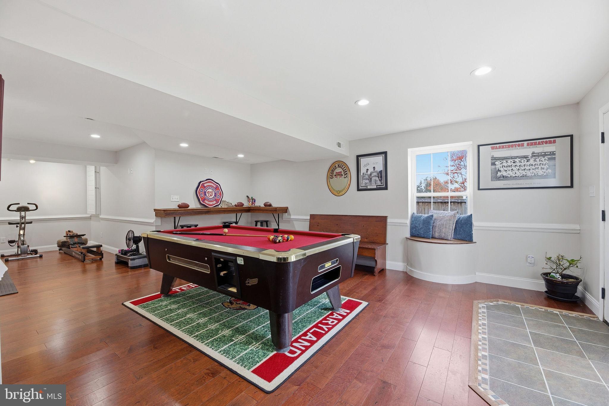 1719 Lottie Fowler Road Prince Frederick, MD 20678 - Photo 32 of 62 a living room with furniture and a table with wooden floor