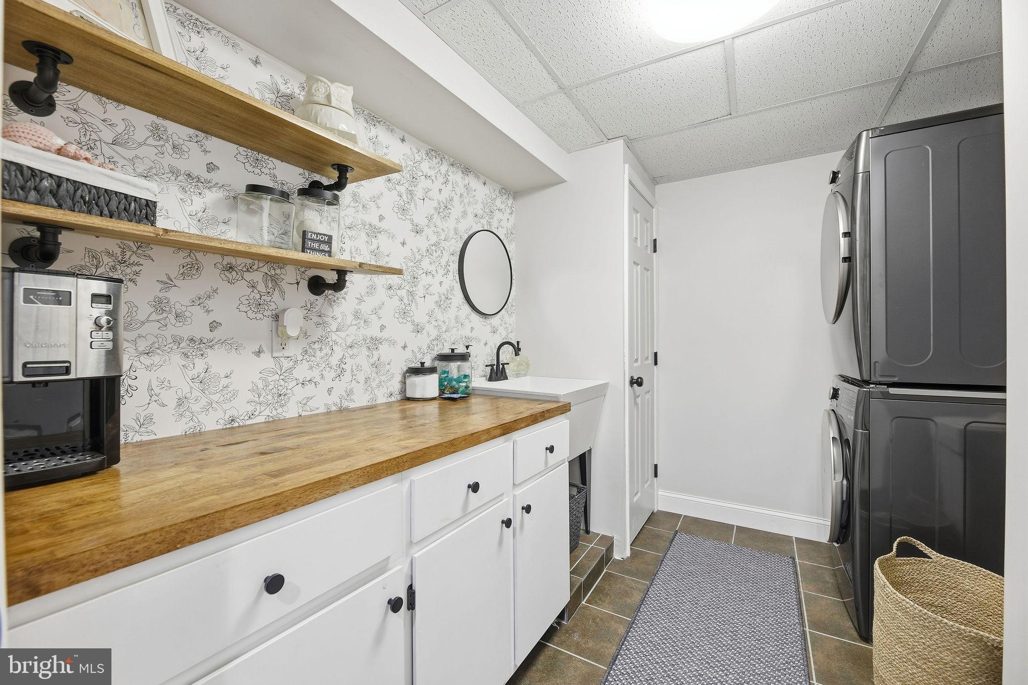 1719 Lottie Fowler Road Prince Frederick, MD 20678 - Photo 39 of 62 a spacious bathroom with a granite countertop sink mirror and shower