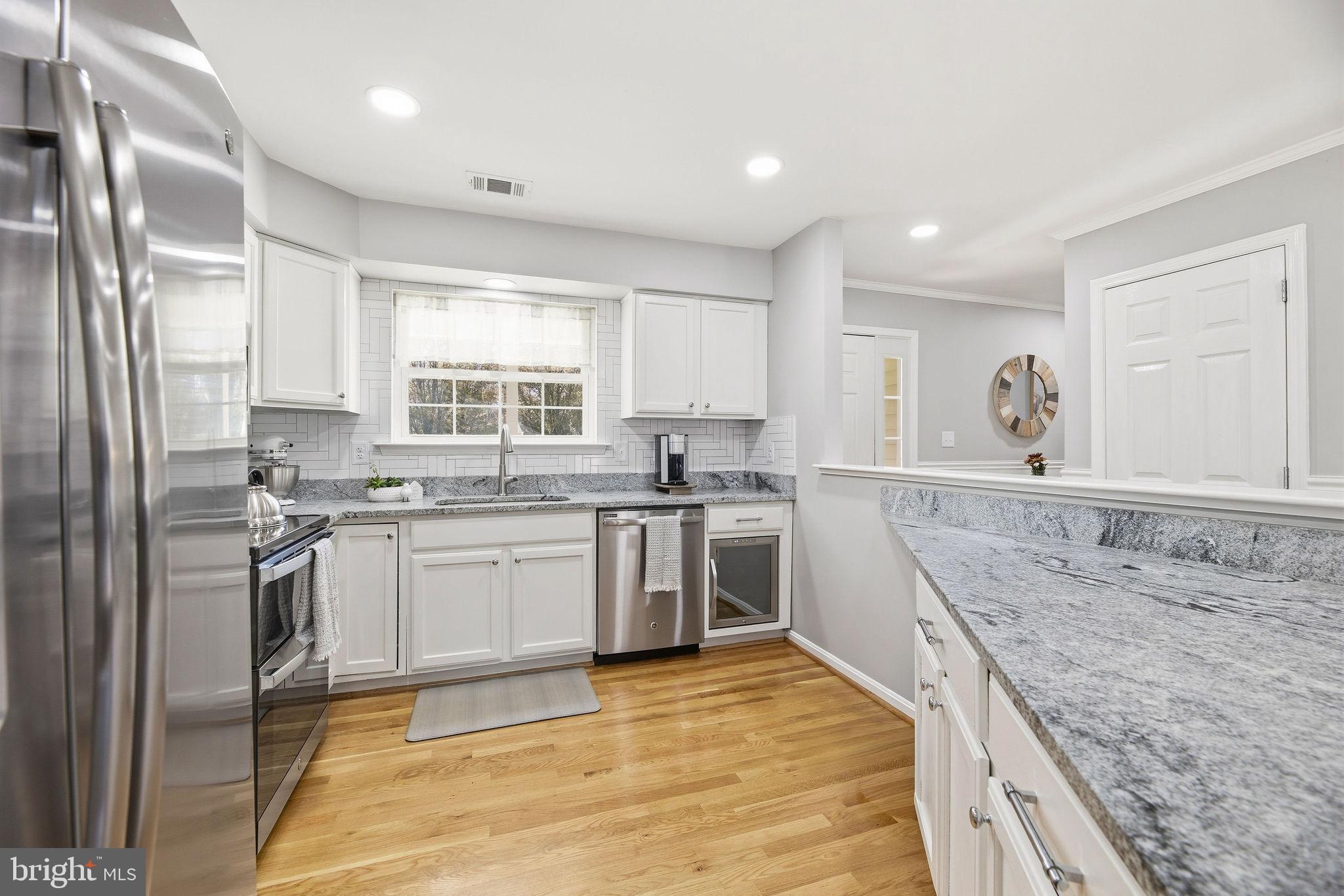 1719 Lottie Fowler Road Prince Frederick, MD 20678 - Photo 4 of 62 a kitchen with stainless steel appliances granite countertop a stove a sink and a refrigerator