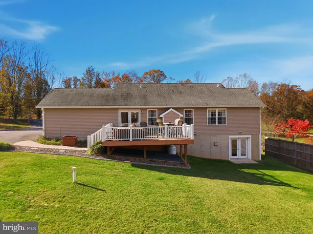 a view of house with outdoor space and swimming pool
