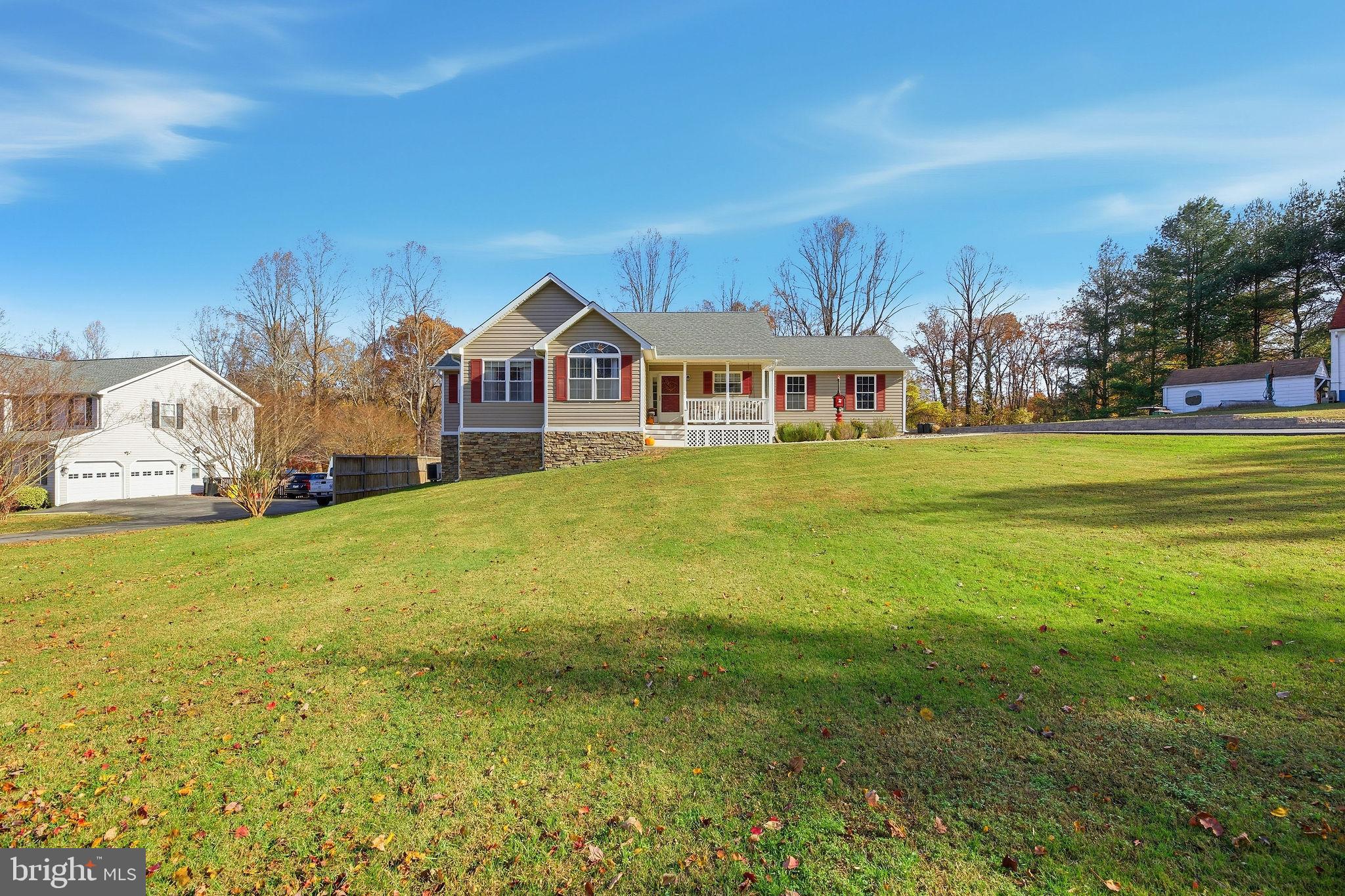 1719 Lottie Fowler Road Prince Frederick, MD 20678 - Photo 58 of 62 a front view of a house with a big yard