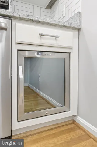 a view of a dining room and livingroom with furniture window and wooden floor