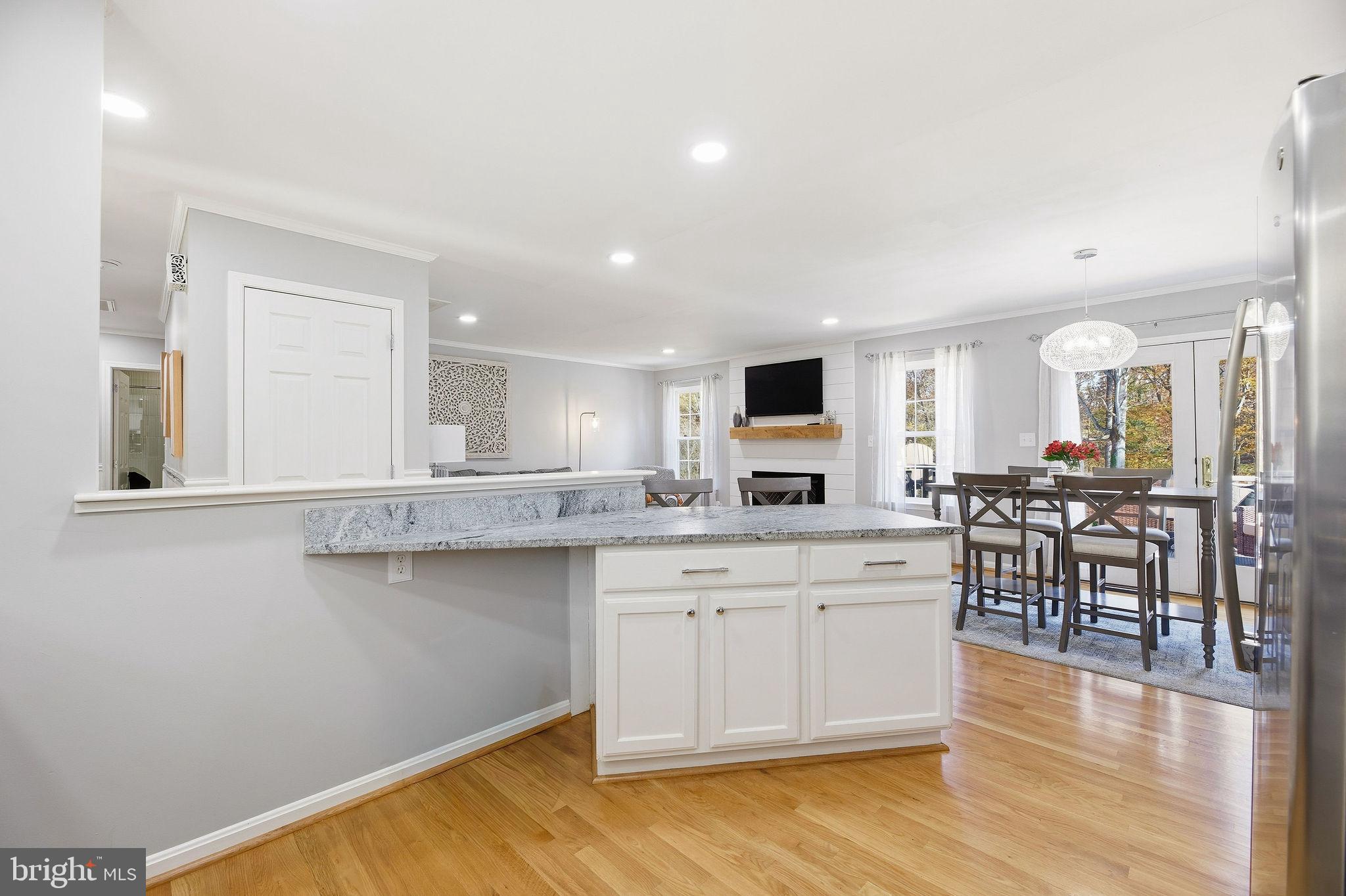 1719 Lottie Fowler Road Prince Frederick, MD 20678 - Photo 9 of 62 a large white kitchen with lots of counter space a sink and appliances