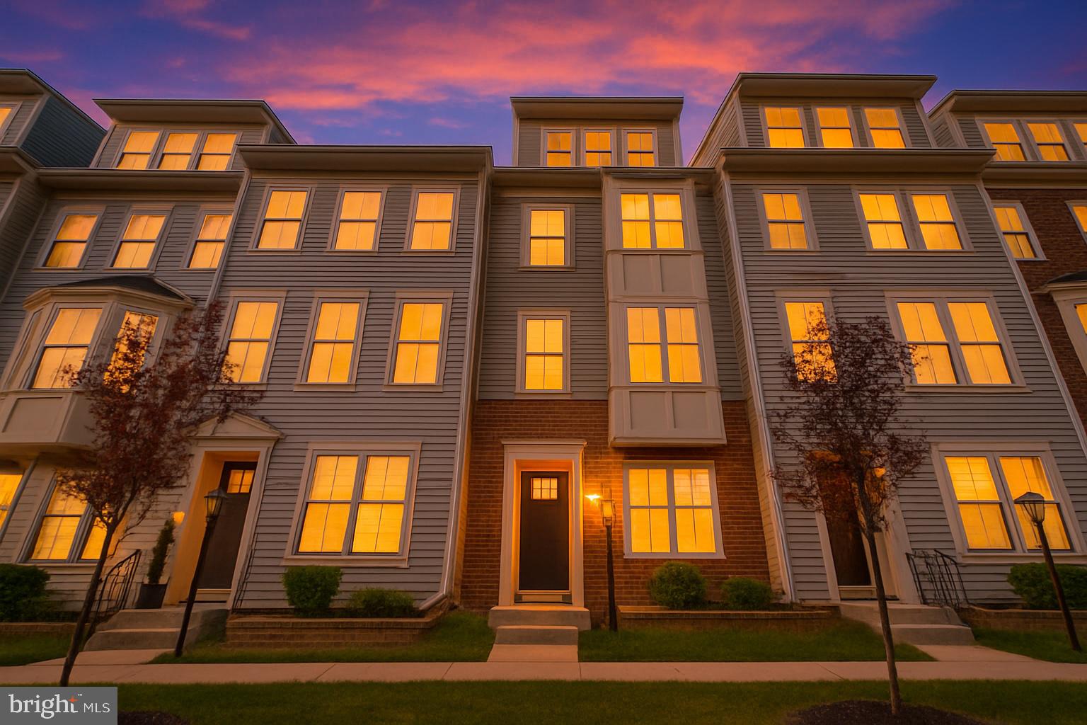 7107 Littlemore Way Hanover, MD 21076 - Photo 1 of 39 a front view of a residential apartment building with a yard