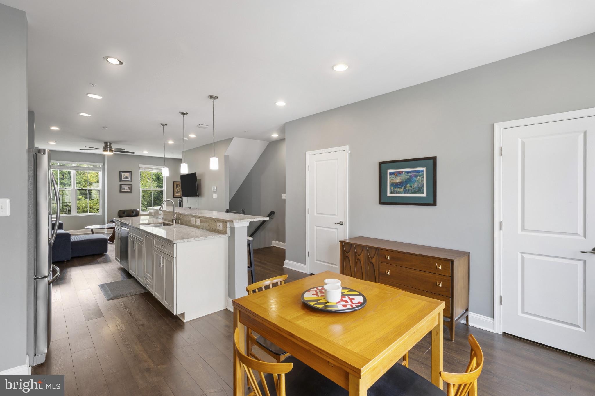 7107 Littlemore Way Hanover, MD 21076 - Photo 13 of 39 a open kitchen with a table and chairs