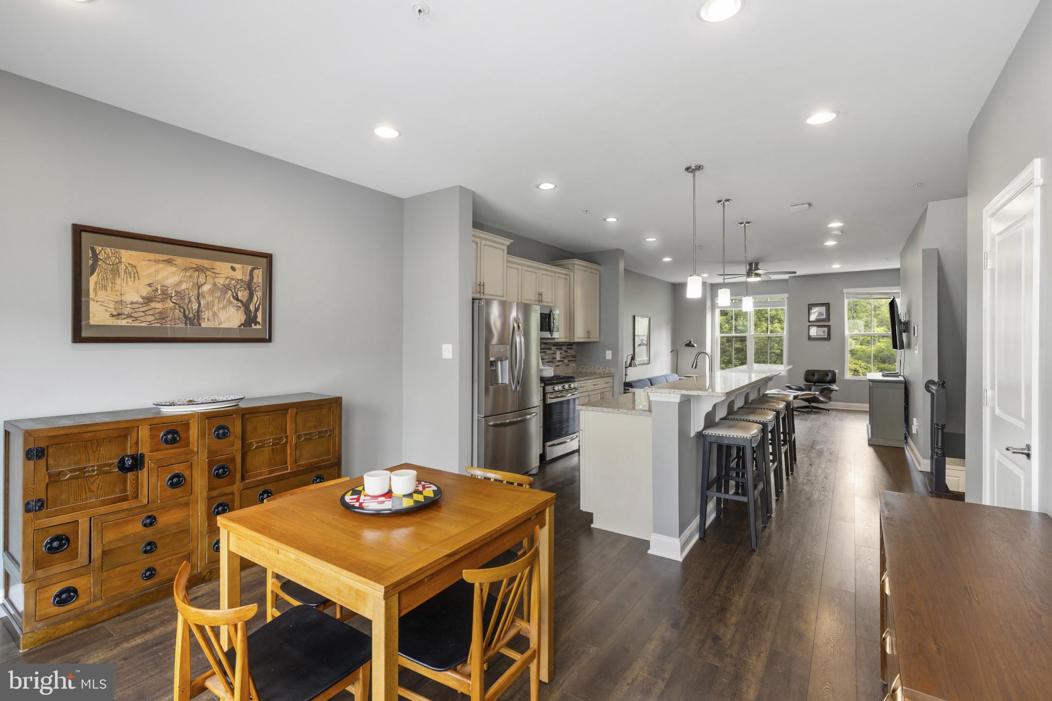 7107 Littlemore Way Hanover, MD 21076 - Photo 14 of 39 a dinning room and kitchen with a table chairs