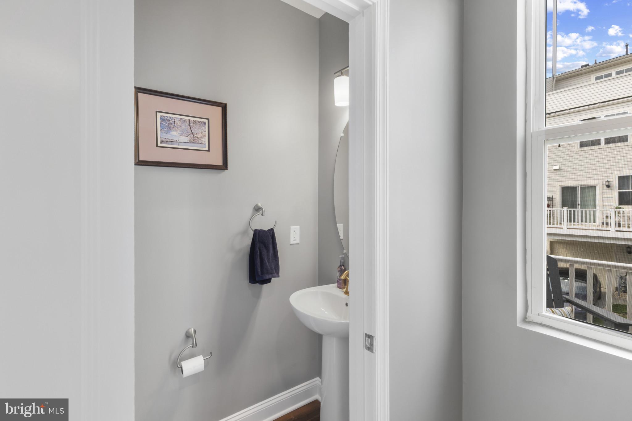 7107 Littlemore Way Hanover, MD 21076 - Photo 20 of 39 a bathroom with a toilet and a shower