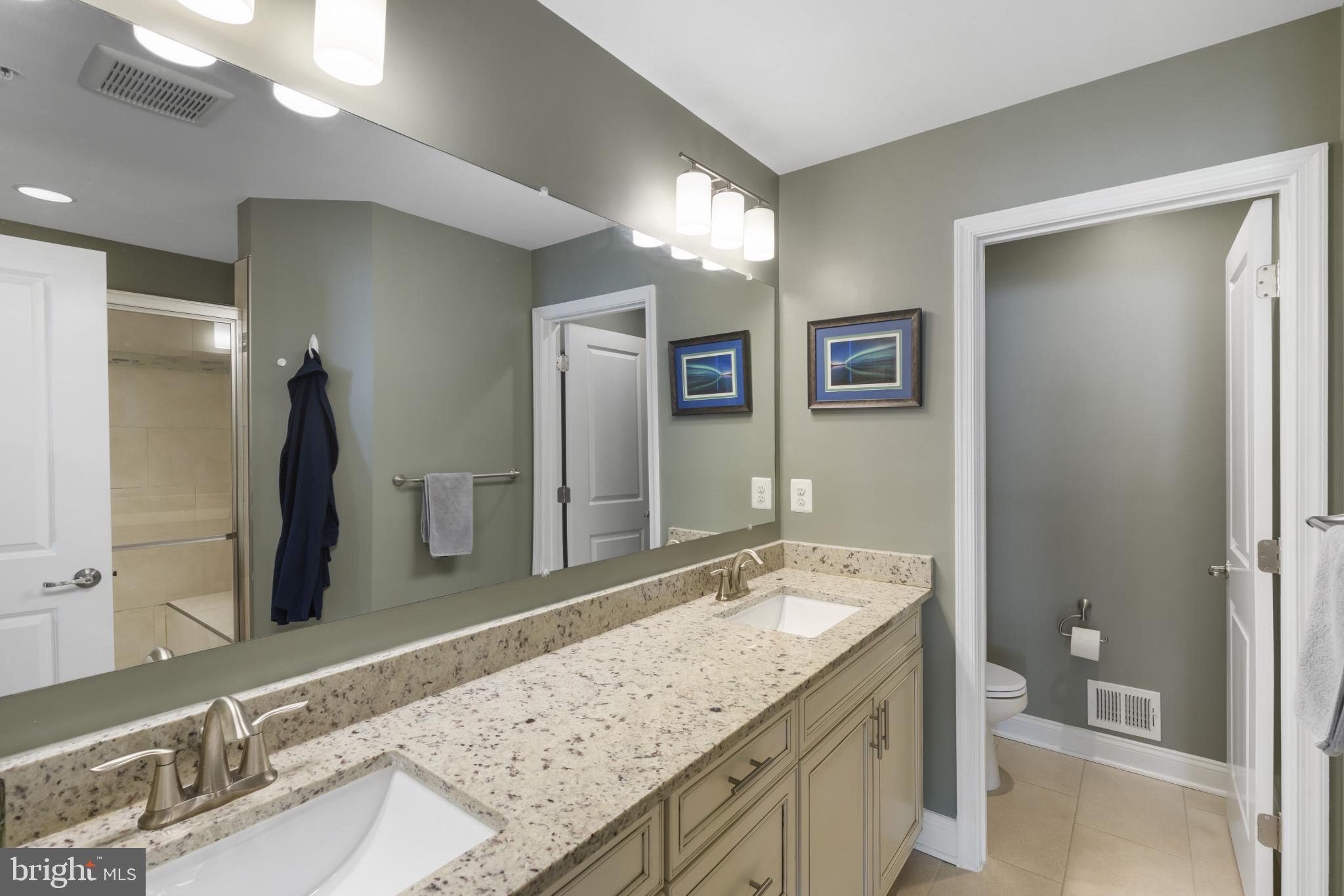 7107 Littlemore Way Hanover, MD 21076 - Photo 24 of 39 a bathroom with a granite countertop double vanity sink and a mirror