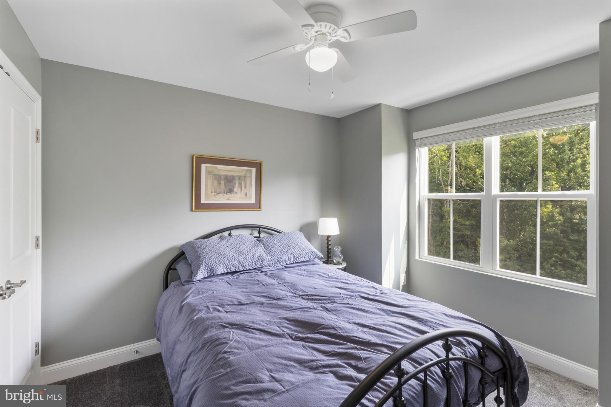 7107 Littlemore Way Hanover, MD 21076 - Photo 26 of 39 a bedroom with a bed and a window