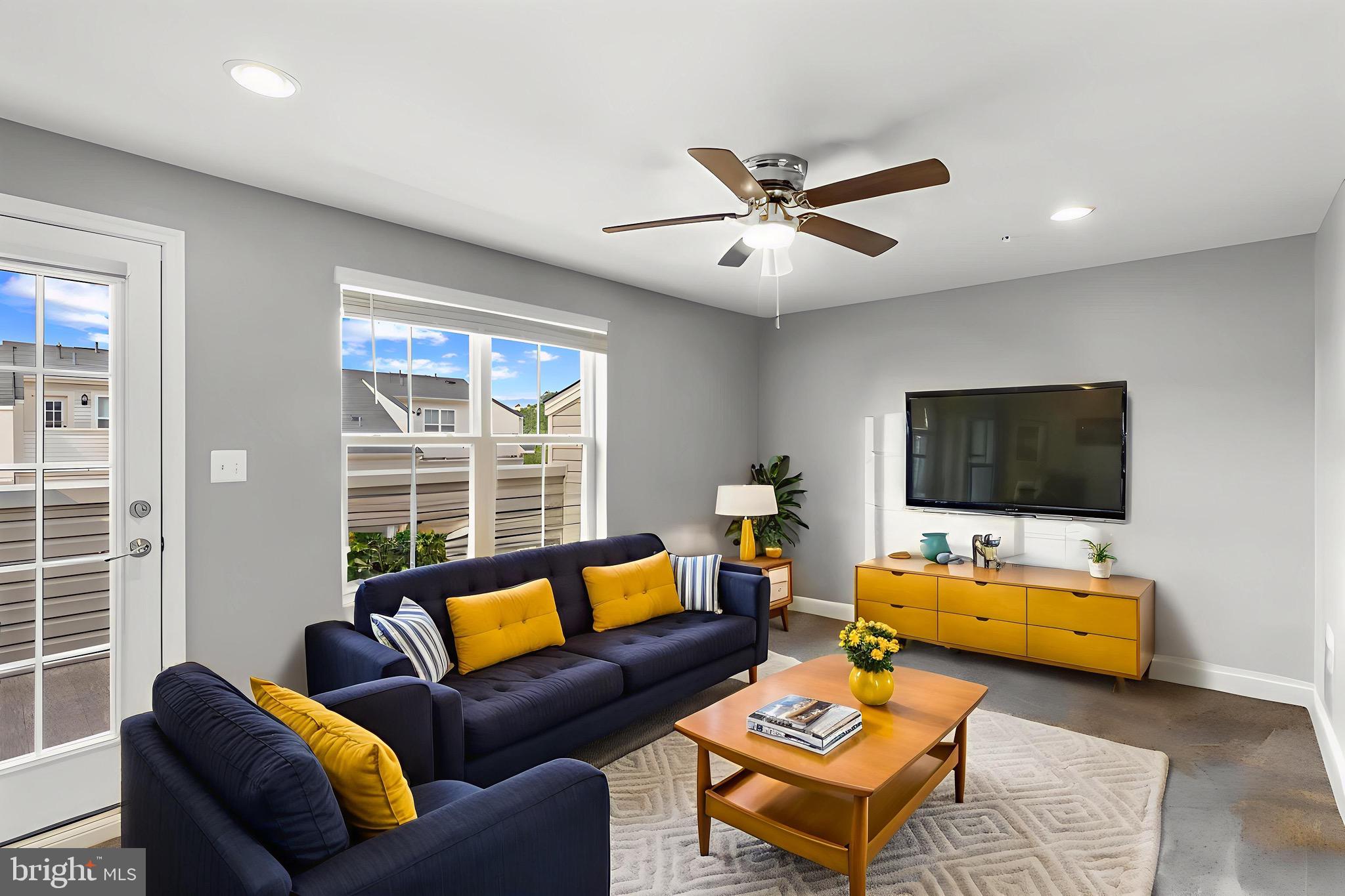 7107 Littlemore Way Hanover, MD 21076 - Photo 29 of 39 a living room with furniture and a flat screen tv