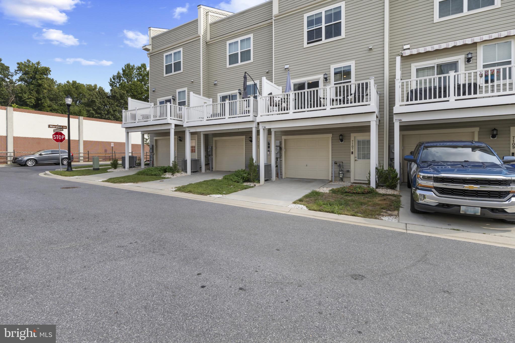 7107 Littlemore Way Hanover, MD 21076 - Photo 36 of 39 a view of a car park in front of a building