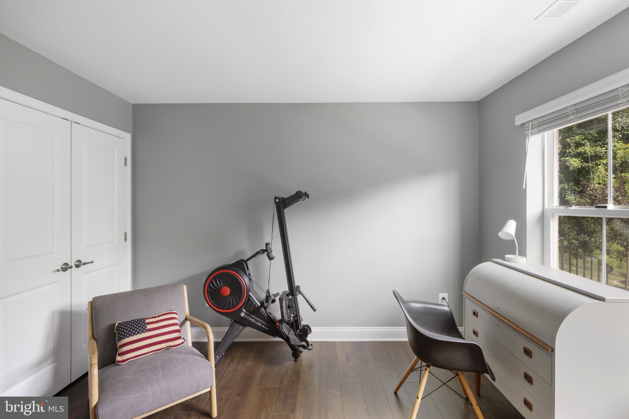 7107 Littlemore Way Hanover, MD 21076 - Photo 6 of 39 a view of a workspace with furniture and a window