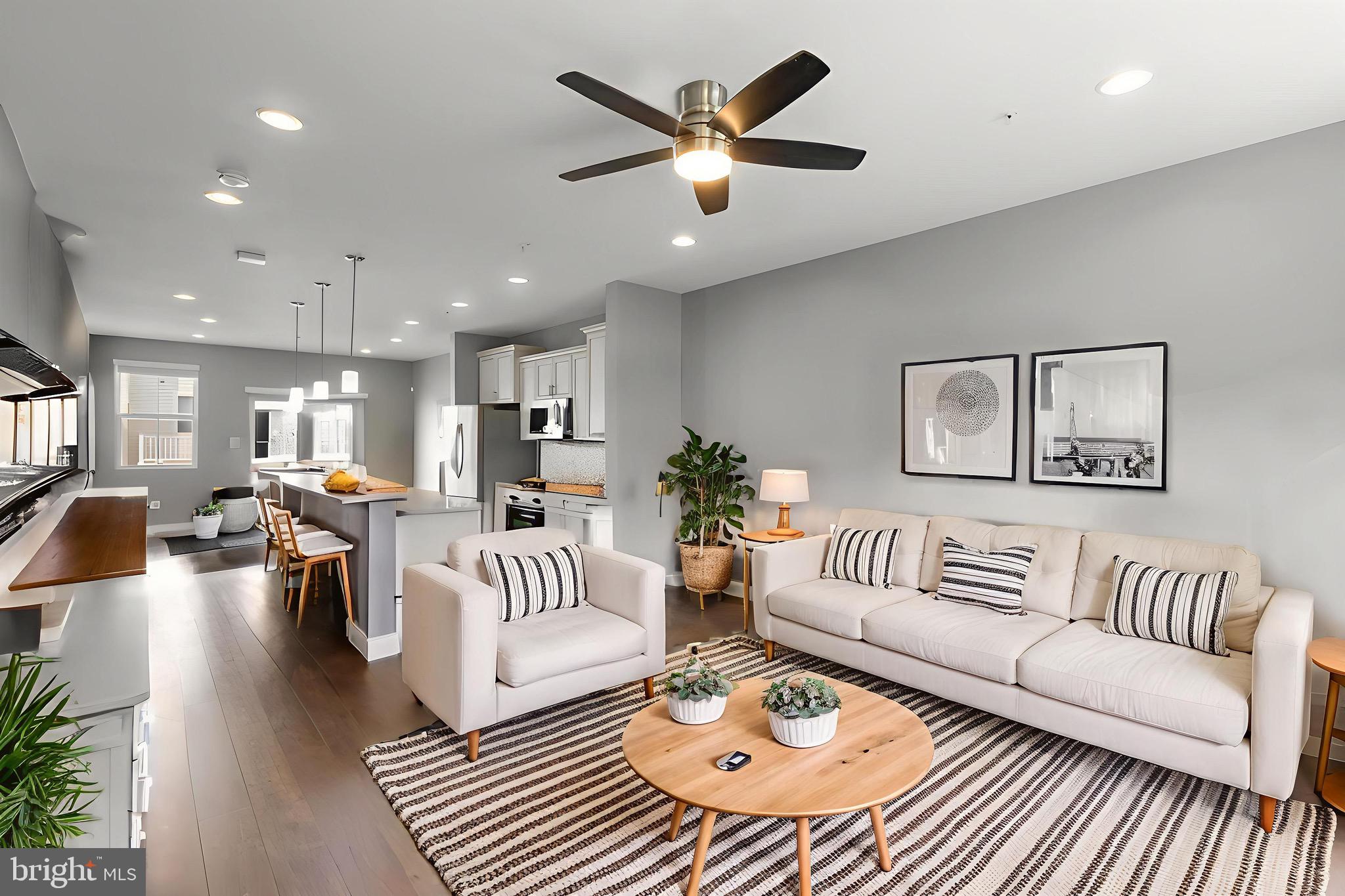 7107 Littlemore Way Hanover, MD 21076 - Photo 9 of 39 a living room with furniture and a large window