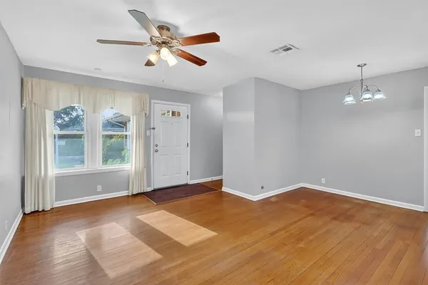 a view of an empty room with a window